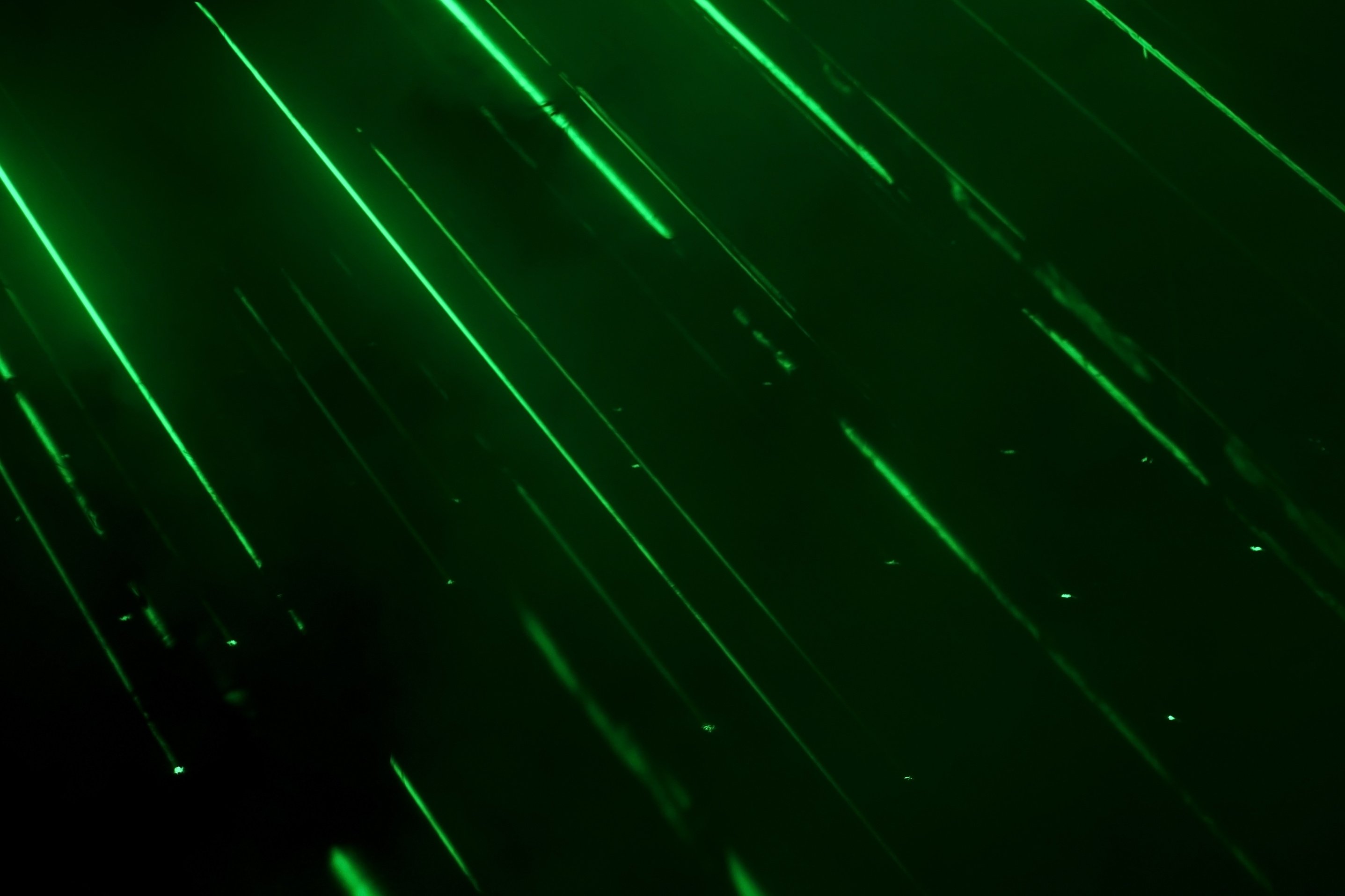 Green Laser on Black Background